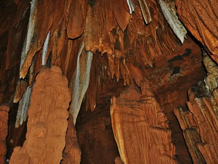 Round Spring Campground — Copper-colored stalactites hang from the ceiling of Big Spring Cave