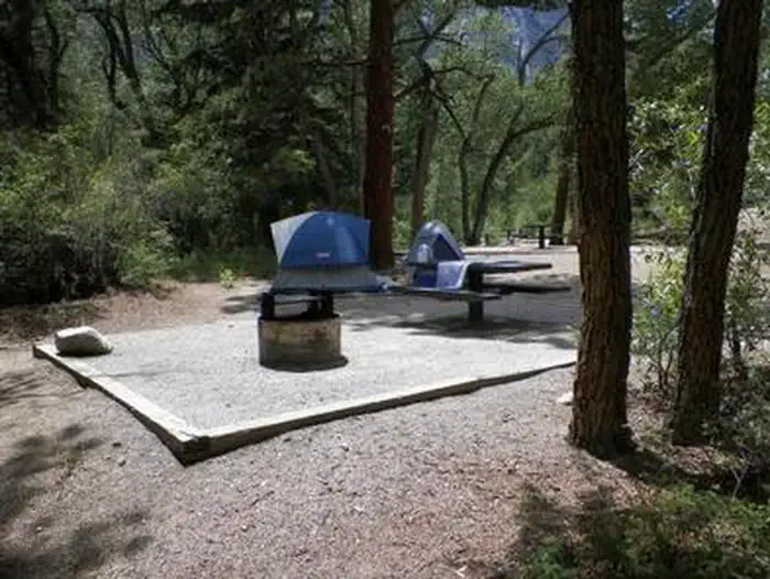 Chalk Lake — Campsite in trees with tents, fire pit and picnic table