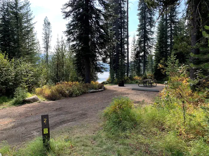 Upper Payette Lake Campground — UPPER PAYETTE LAKE CAMPGROUND Campsite (4) with view of lake in the background.