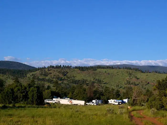 Arch Dam Campground — Trucks and trailers in a group location.