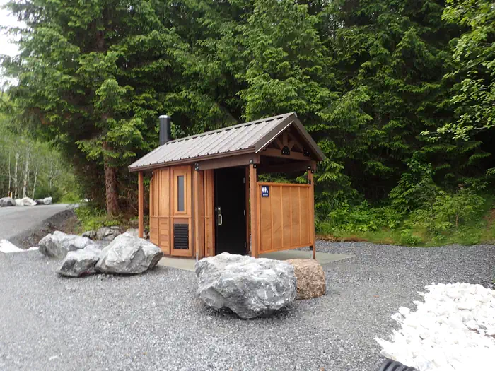 El Capitan Campground — outhouse with large boulders and trees