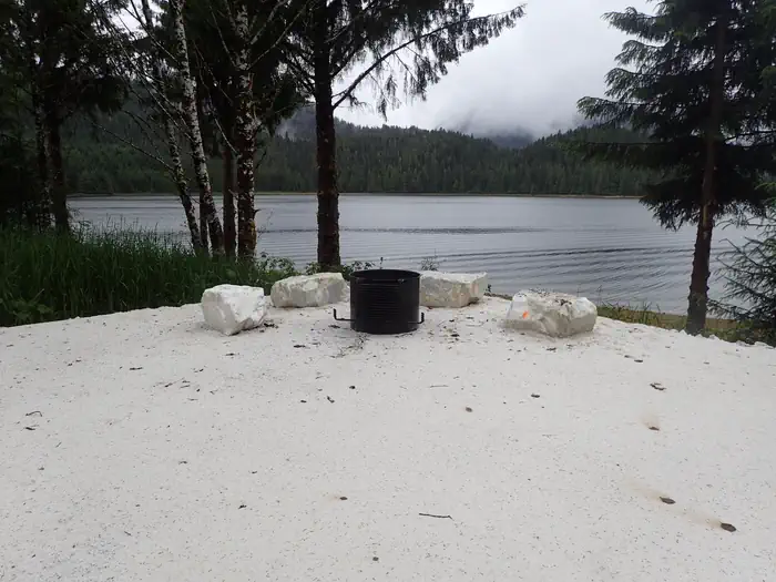 El Capitan Campground — combination fire pit and fire grill at campsite with view of ocean