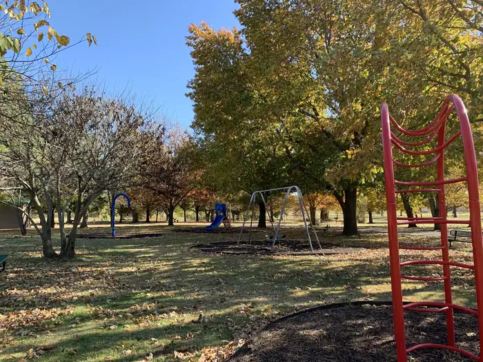 Brush Creek Public Use Area — Children's playground filled with a swing set, slide, and monkey bars located in the Brush Creek campground.
