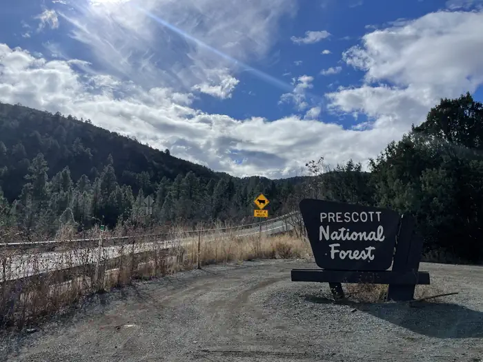 Mingus Mountain Campground and Group Site — A photo of Mingus Mountain marker sign showing the boundary to the Prescott National Forest sign