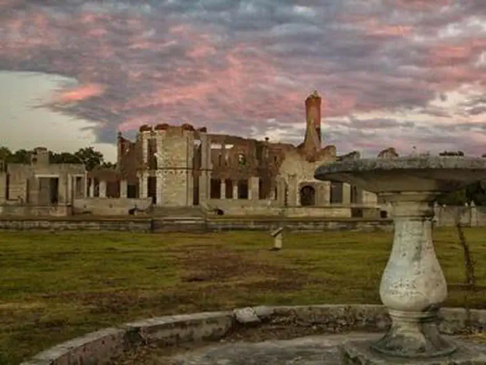 Cumberland Island National Seashore Camping Permits — dungeness ruins under pink clouds
