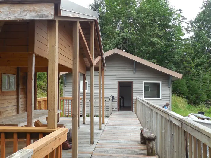Deep Bay Cabin — Deep Bay Cabin walkway to cabin with covered picnic table on the left