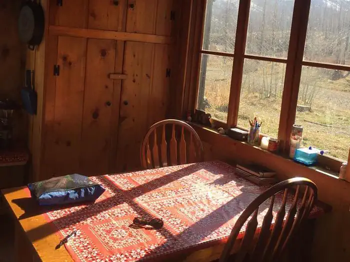 WEST FORK CABIN (W OF CHOTEAU) — Dining table with view outside window