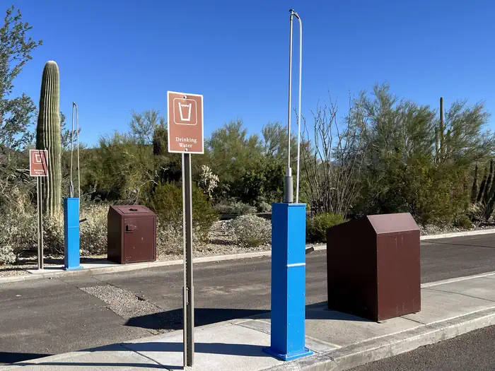 TWIN PEAKS CAMPGROUND — Twin Peaks dump station, with trash receptacles and potable/non-potable hoses.