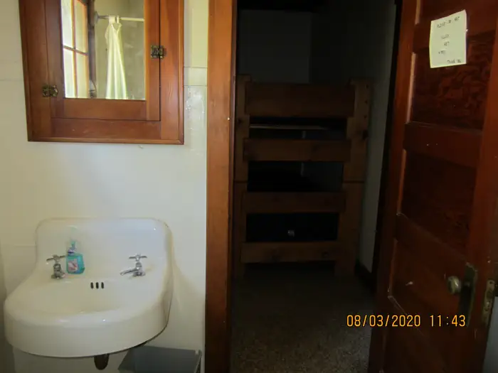 Barber Flat Cabin (Boise National Forest, ID) — A bathroom sink across from the bunk beds.