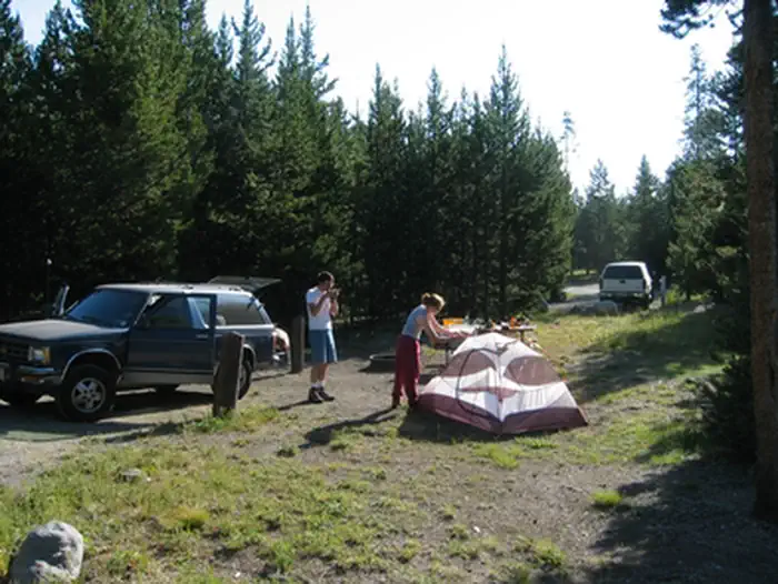 Indian Creek Campground (Yellowstone) — Two campers set up a tent at Indian Creek Campground