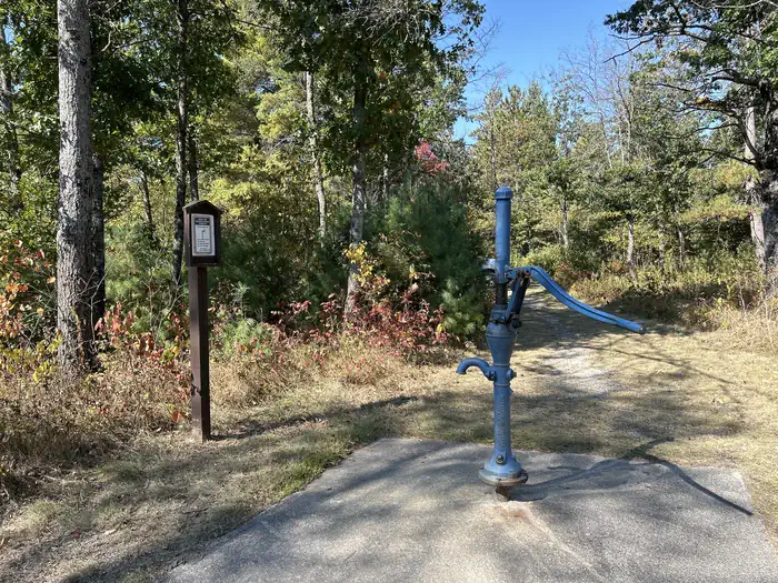 Au Sable Loop Campground & Day Use Area — A photo of hand pump water Au Sable Loop Campground