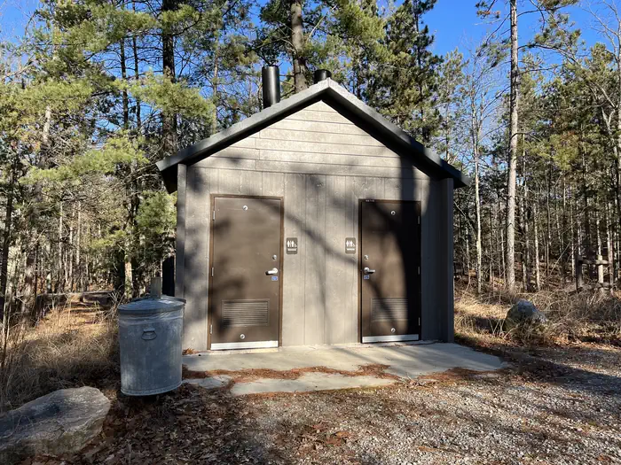 Island lake (MI) — A photo of a vault toilet and trash facility at Island lake (MI)