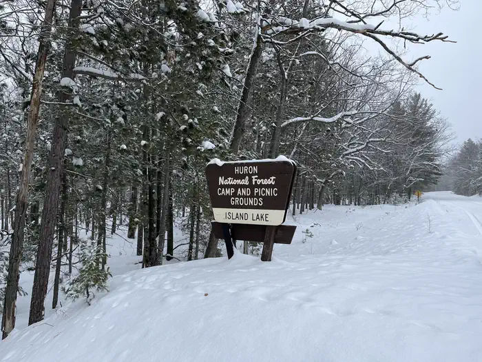 Island lake (MI) — A snowy photo of Island lake (MI) sign