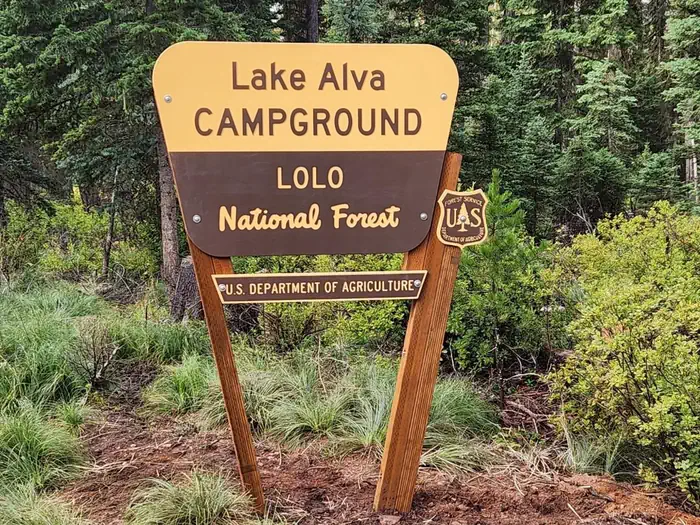 Lake Alva Campground — A photo of the campground entrance sign. It reads: Lake Alva Campground, Lolo National Forest, U.S. Department of Agriculture.