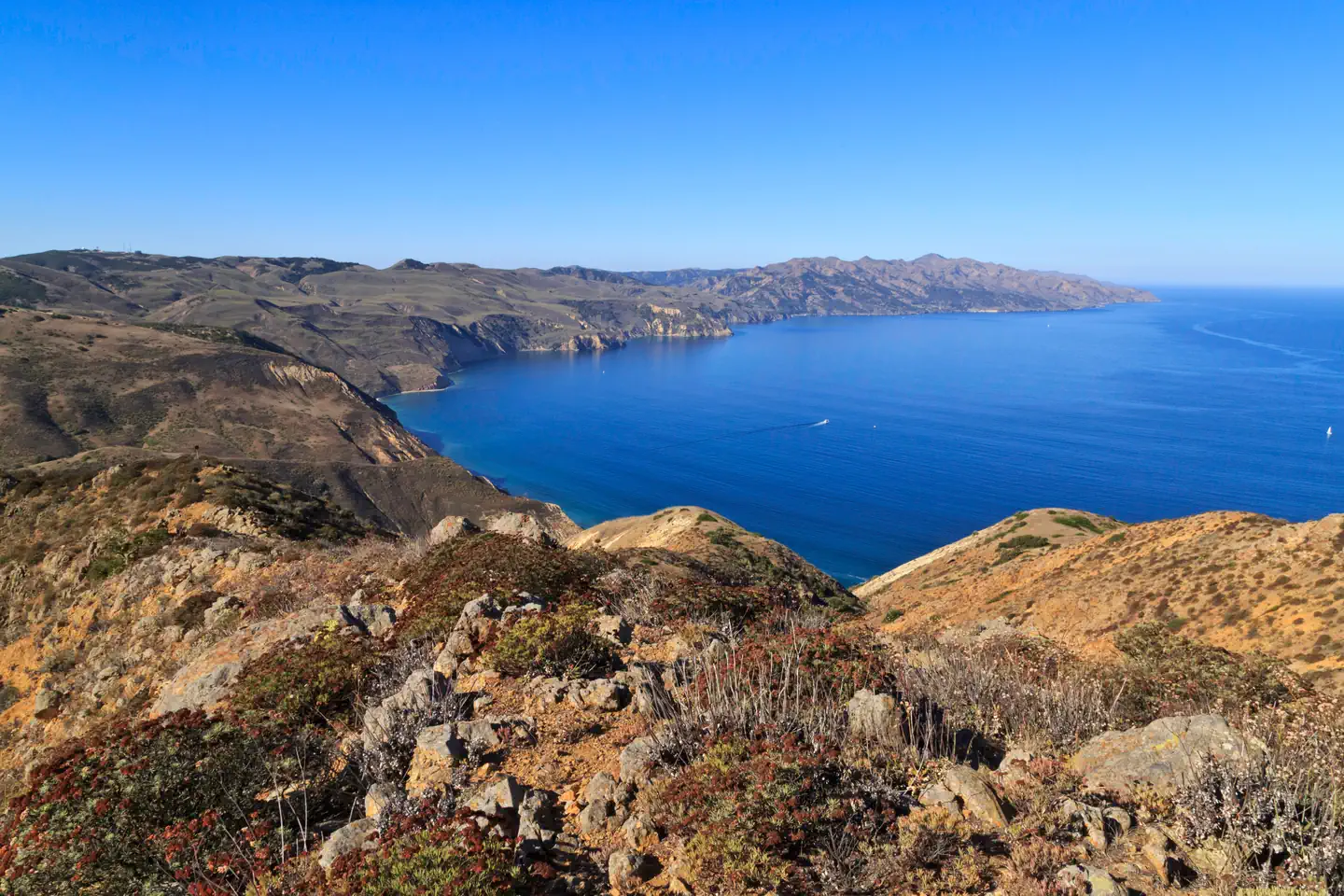 SANTA CRUZ DEL NORTE BACKCOUNTRY — View from a high ridge overlooking the rest of a long, narrow, rugged island with steep cliffs