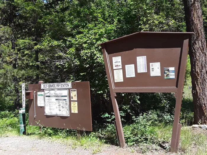 Trout Creek Campground (MT) — Trout Creek Campground self service fee station and information board.