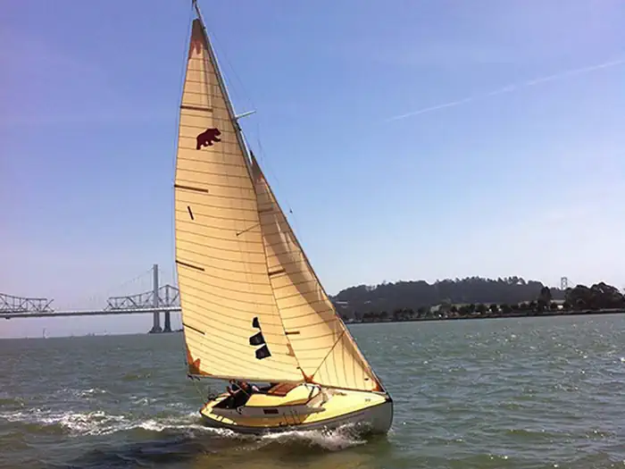 Aquatic Park Cove, Black Point Overnight Anchoring, Sailing Vessels Only (auxiliary Engine Ok) — Bear Boat "The Merry Bear" one of the small crafts in the park's historic collection, sailing on San Francisco Bay