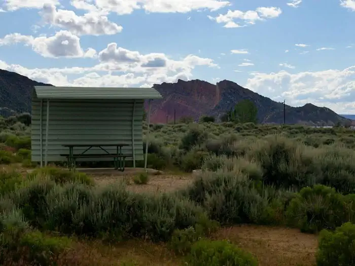 Antelope Flat (ashley National Forest, Ut) — Picnic table with a shelter covering one side and over head.