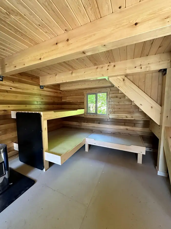 Anan Bay Cabin — Wood cabin interior with bunks