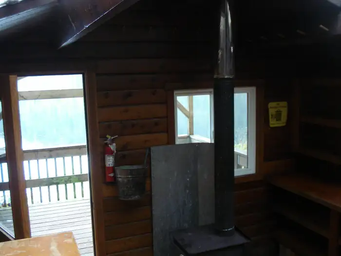 Jordan Lake Cabin — Front Half of interior including kitchen area and stove