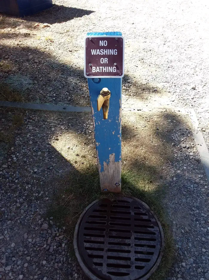 Demotte — Campground water spigot with no washing or bathing sign