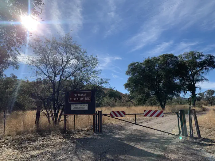 Calabasas — A locked entry gate to the campground with a sign that says "Calabasas Recreation Site"ite