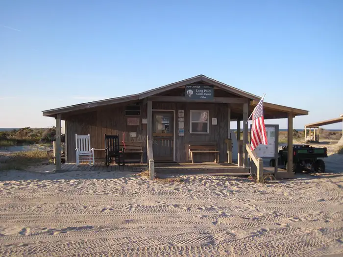 Long Point Cabin Camp — The sandy entrance to the Long Point Cabin Camp Office with beach dune in the background