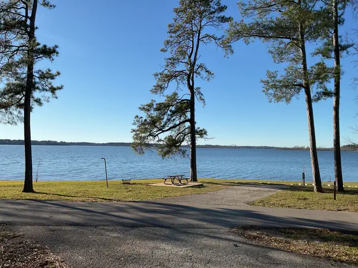 San Augustine — A photo of facility SAN AUGUSTINE with Picnic Table, Electricity Hookup, Fire Pit, Waterfront, Lantern Pole
