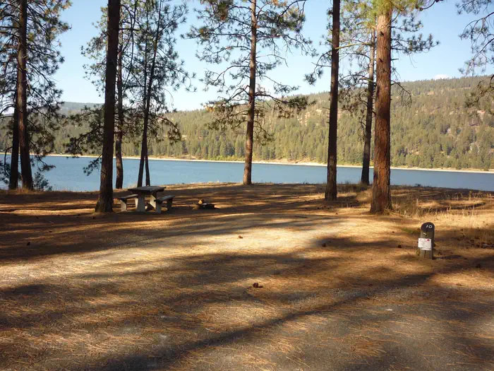 Kettle Falls Campground — Kettle Falls CG with trees and water in the background.