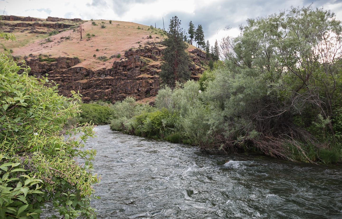 South Fork John Day River Back Country Byway — View of the South Fork John Day River with basalt cliff in distance.