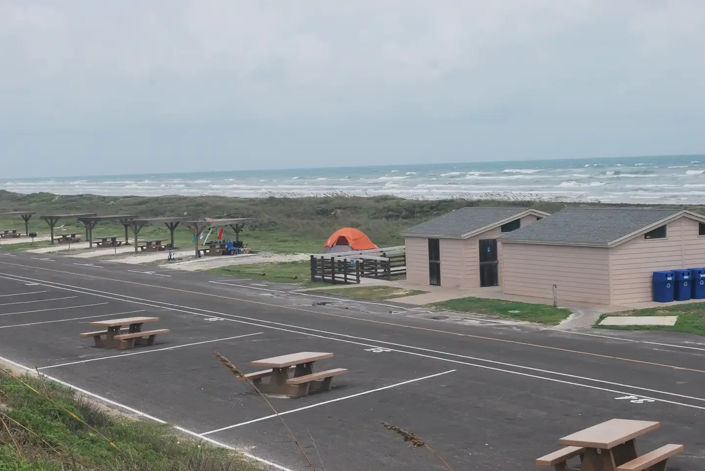 Malaquite Campground - Padre Island National Seashore: Malaquite Campground is tucked in the dunes right next to the beach with 48 sites on pavement and gravel..
