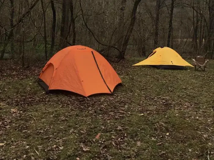 Round Spring Campground - Ozark National Scenic Riverways: An orange and a yellow tent pitched at Round Spring