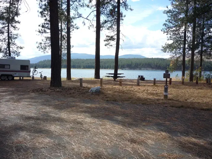 Gifford Campground - Lake Roosevelt National Rec Area: Gifford Campground with trees and lake in the background.