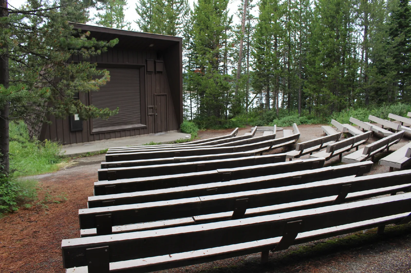 Amphitheater with building and bench seats at campground