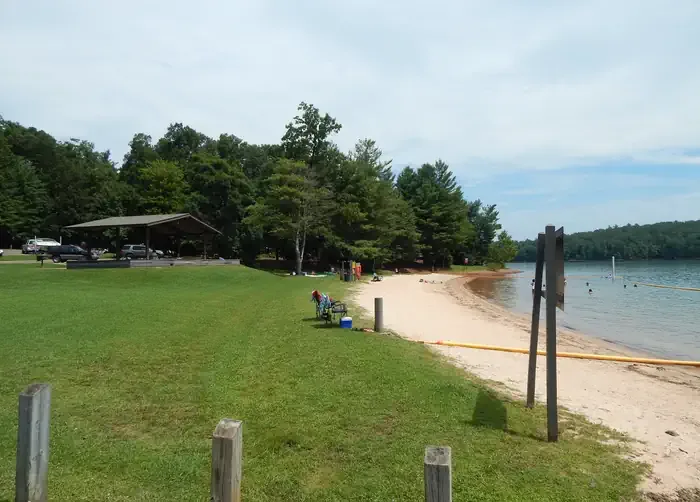 COE Philpott Lake Goose Point Park: A grassy approach as you head toward the sandy beach and swim area at Philpott Lake's Goose Point.