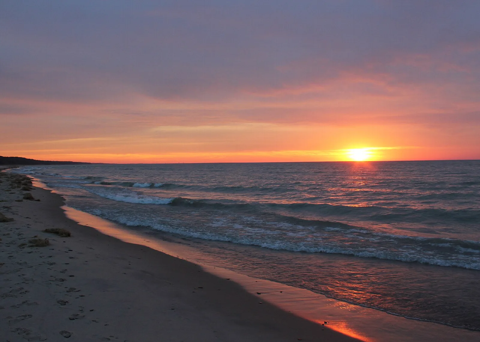 Sunset over Lake Michigan from a sandy beach