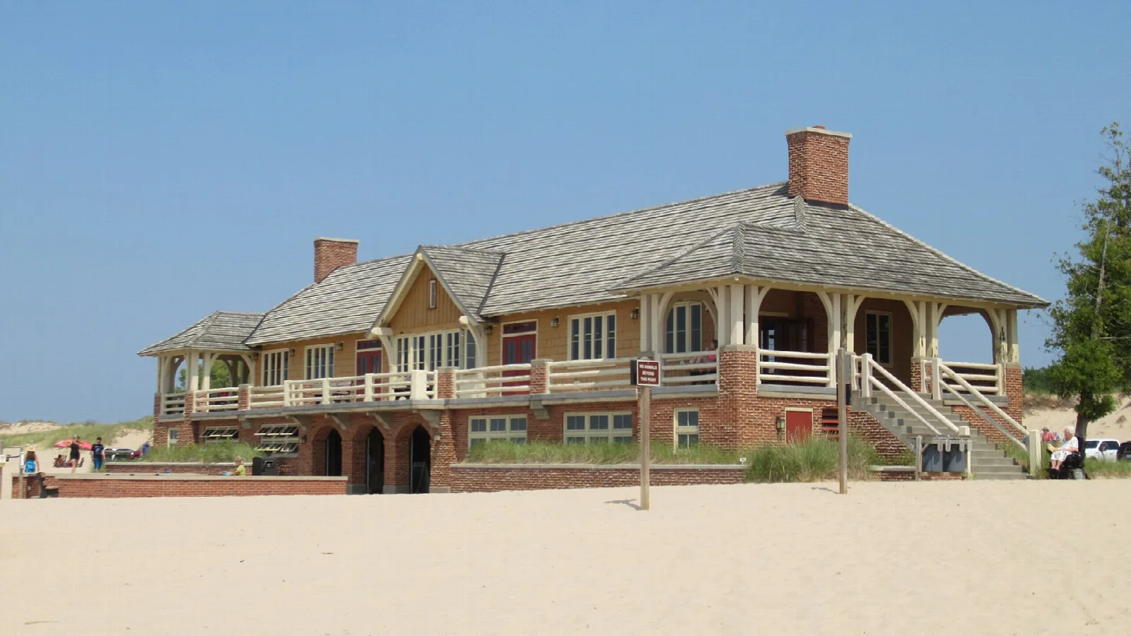 Beach house with a porch on a sandy beach