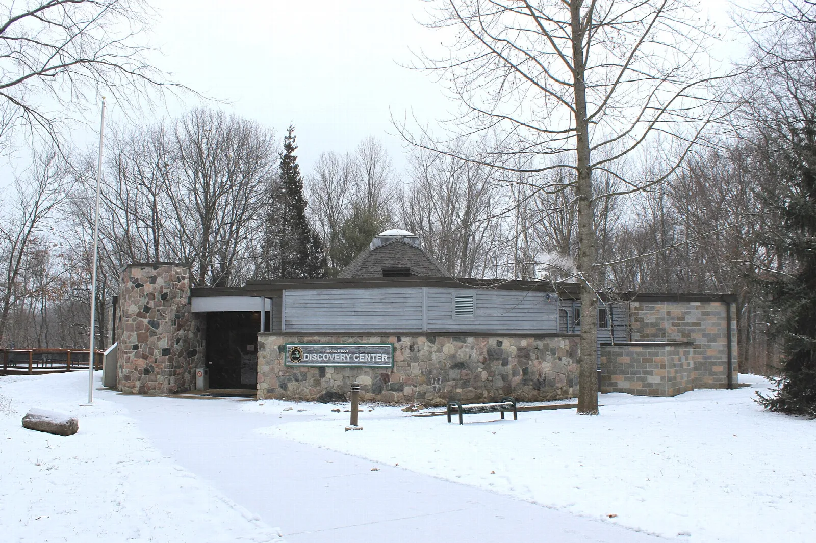 Stone and wood nature center in a snowy clearing
