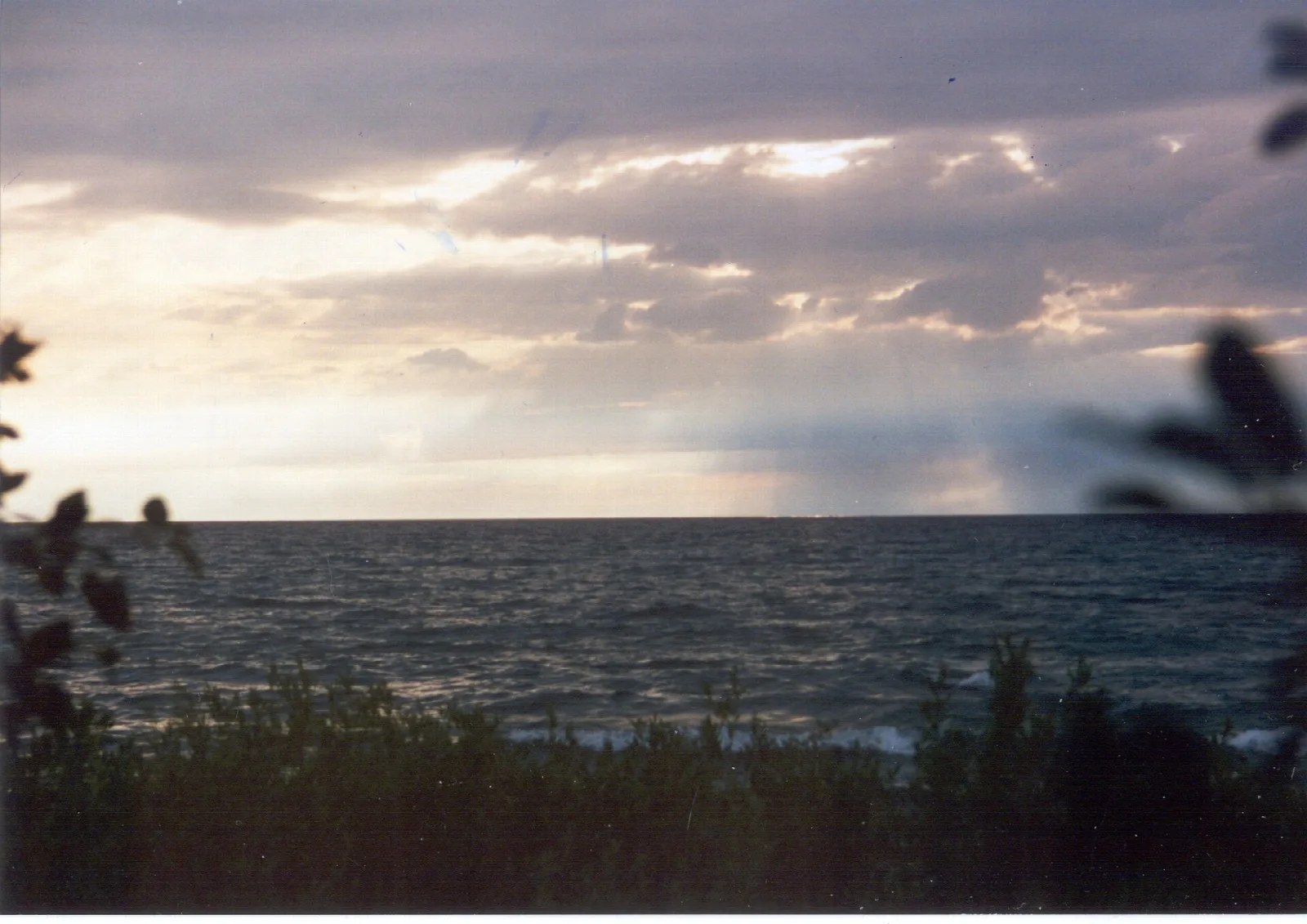 Sunset clouds over the dark water of Lake Michigan