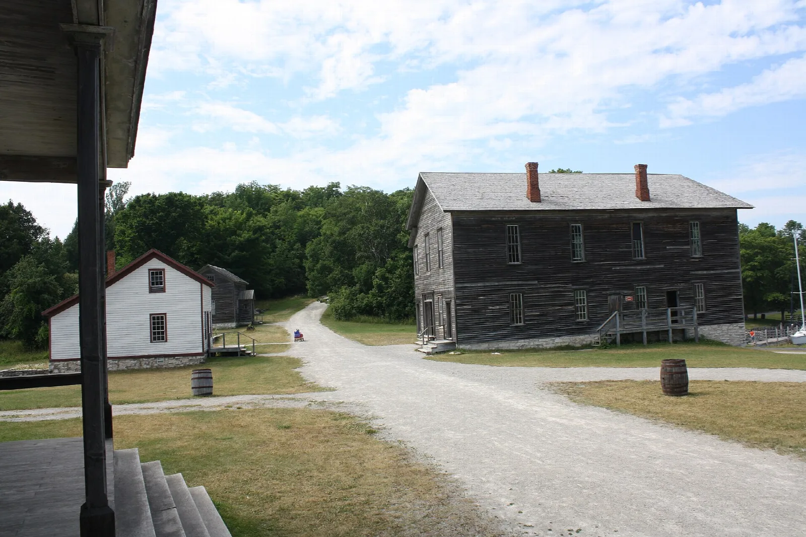Gravel street lined with old wooden buildings