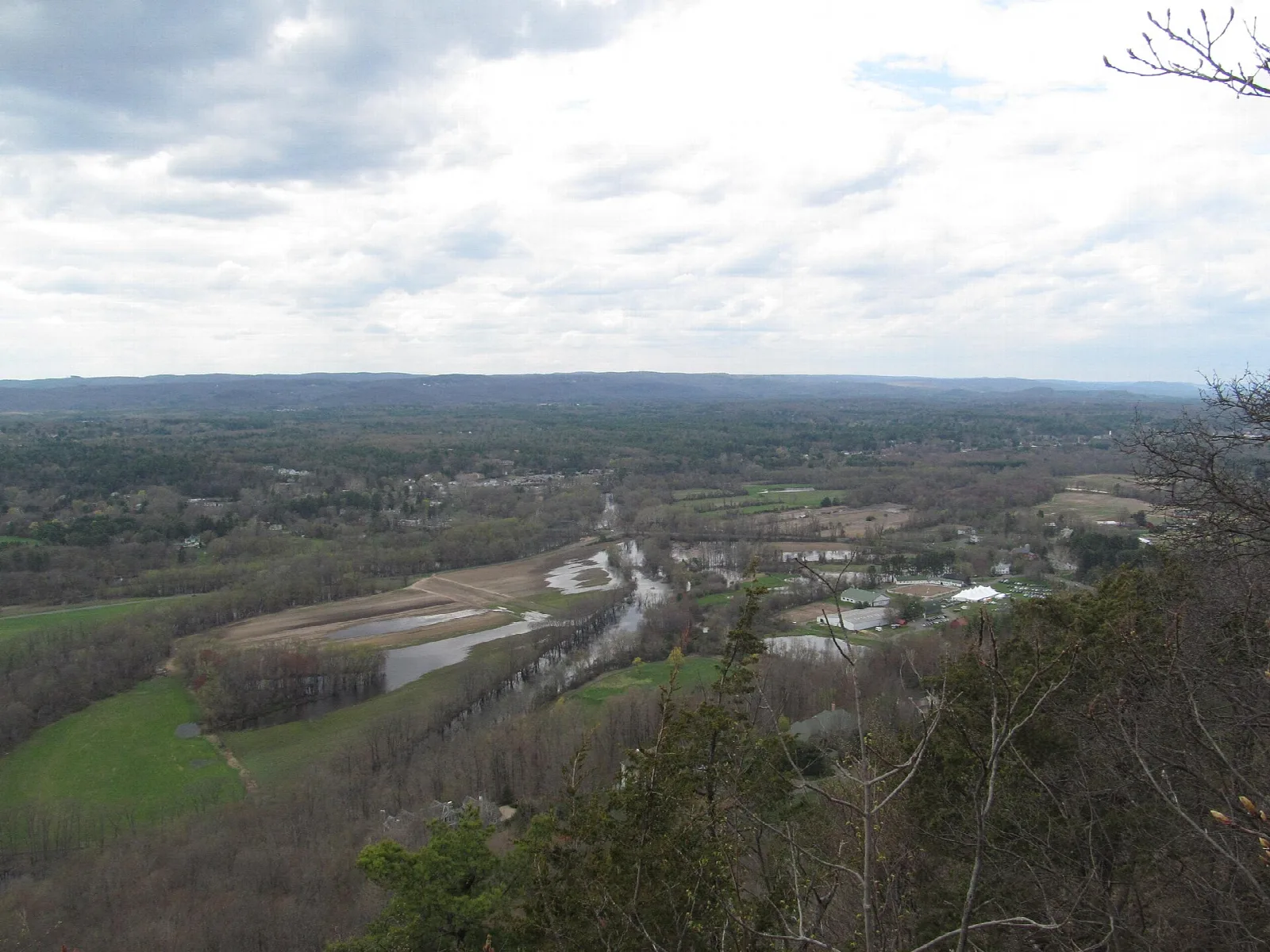 Wide valley view under a cloudy sky