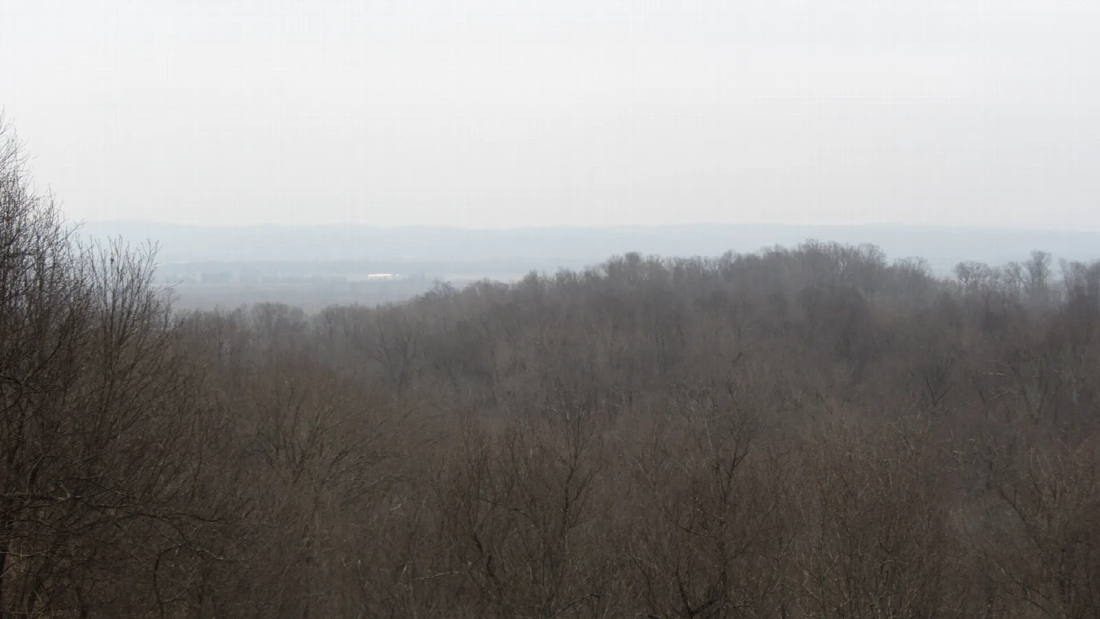 Hazy view over bare hills toward the Mississippi River