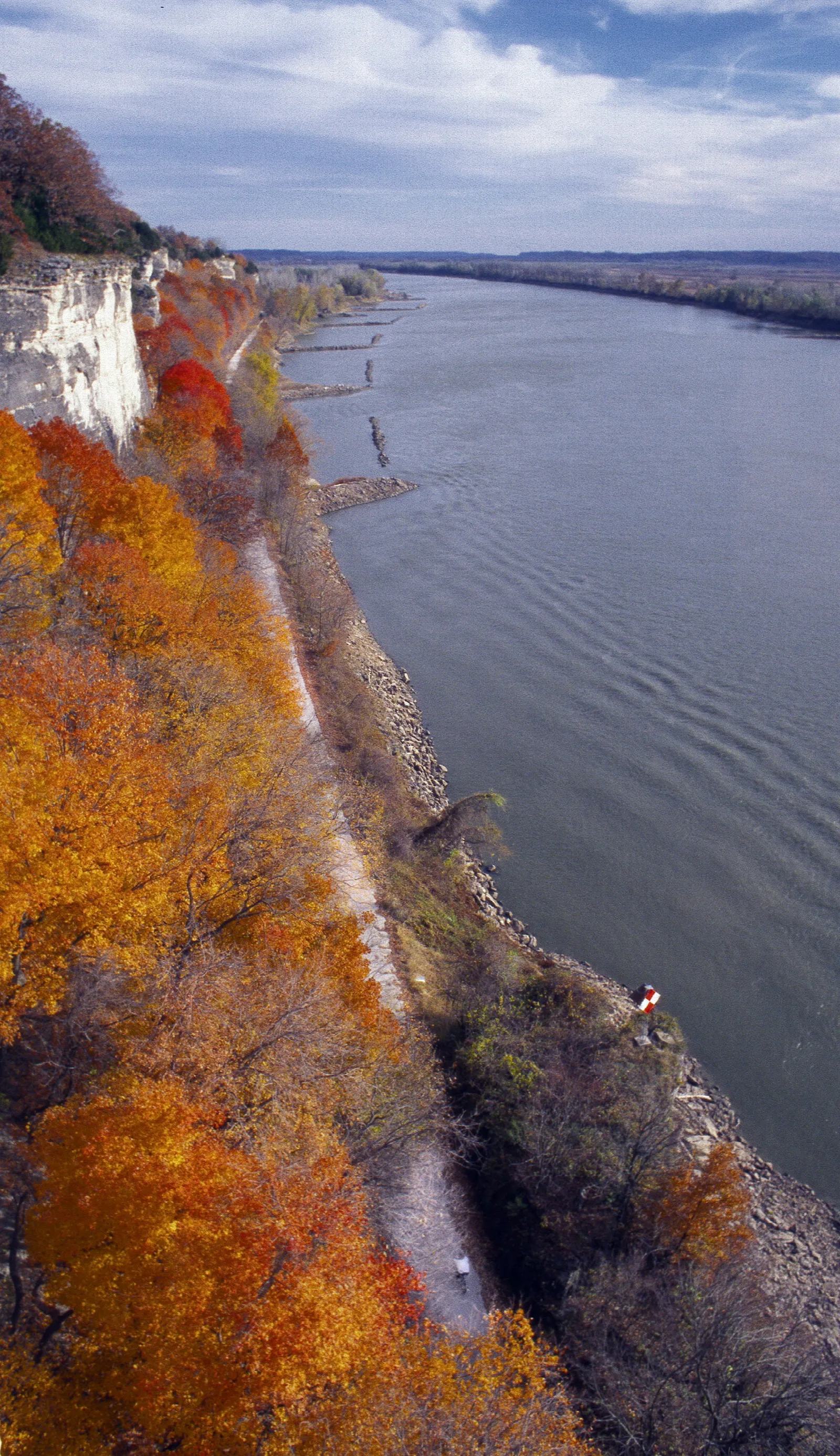 Orange autumn bluff above a wide river