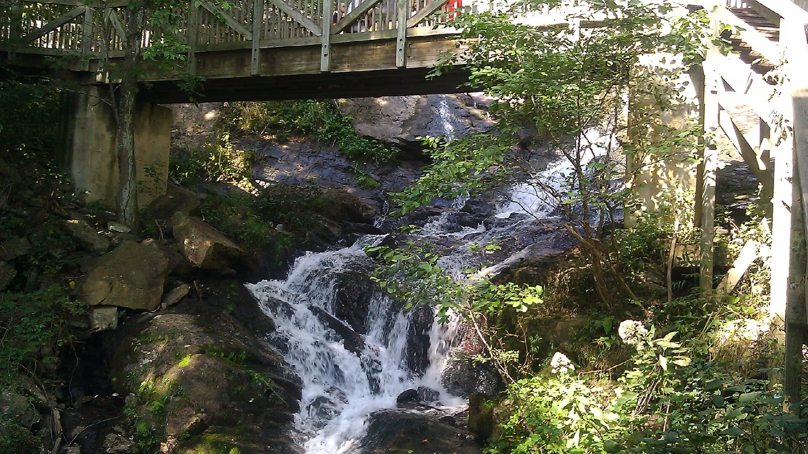Footbridge above a small cascade over rocks