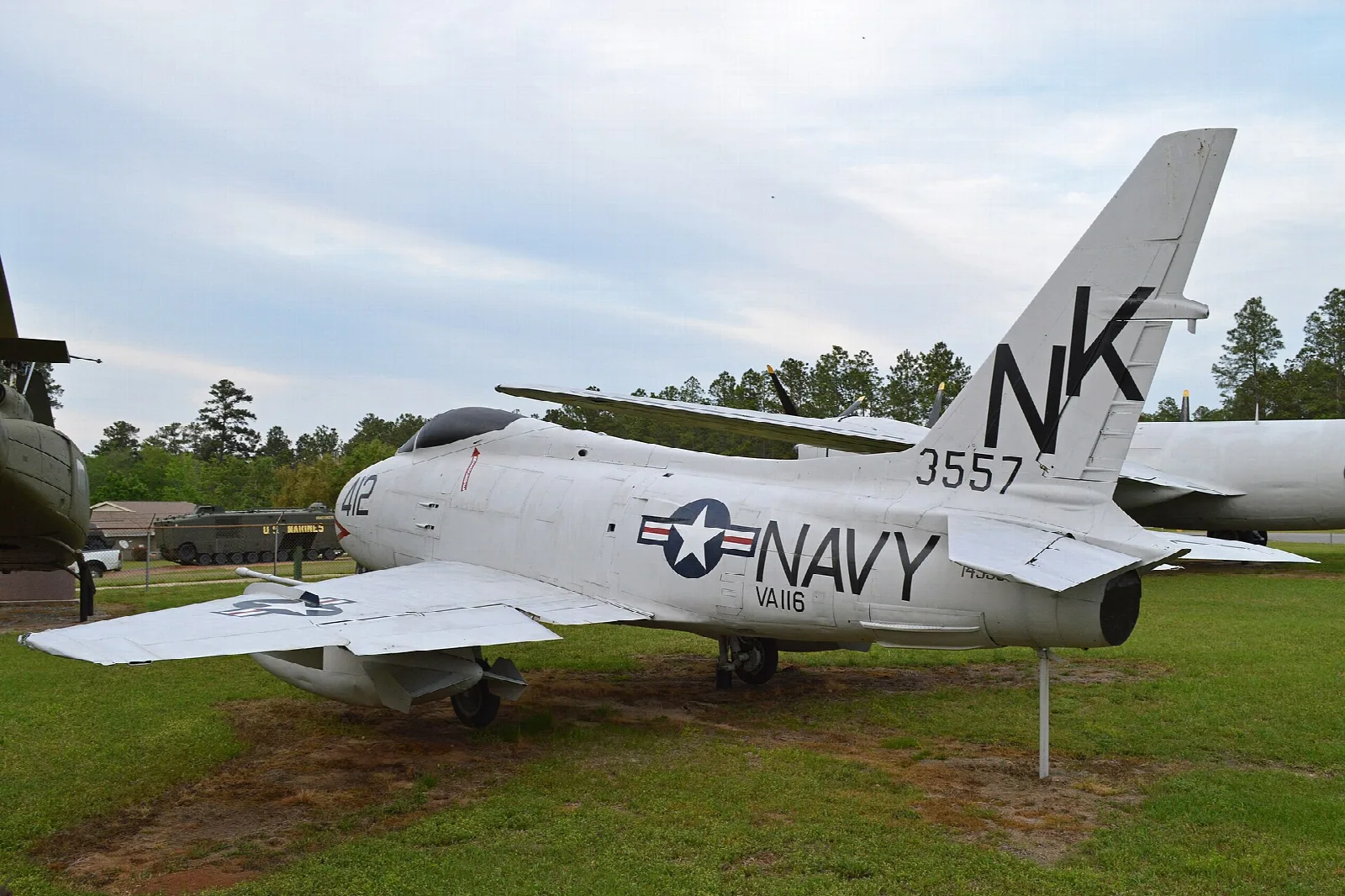 Navy jet fighter on display on a lawn
