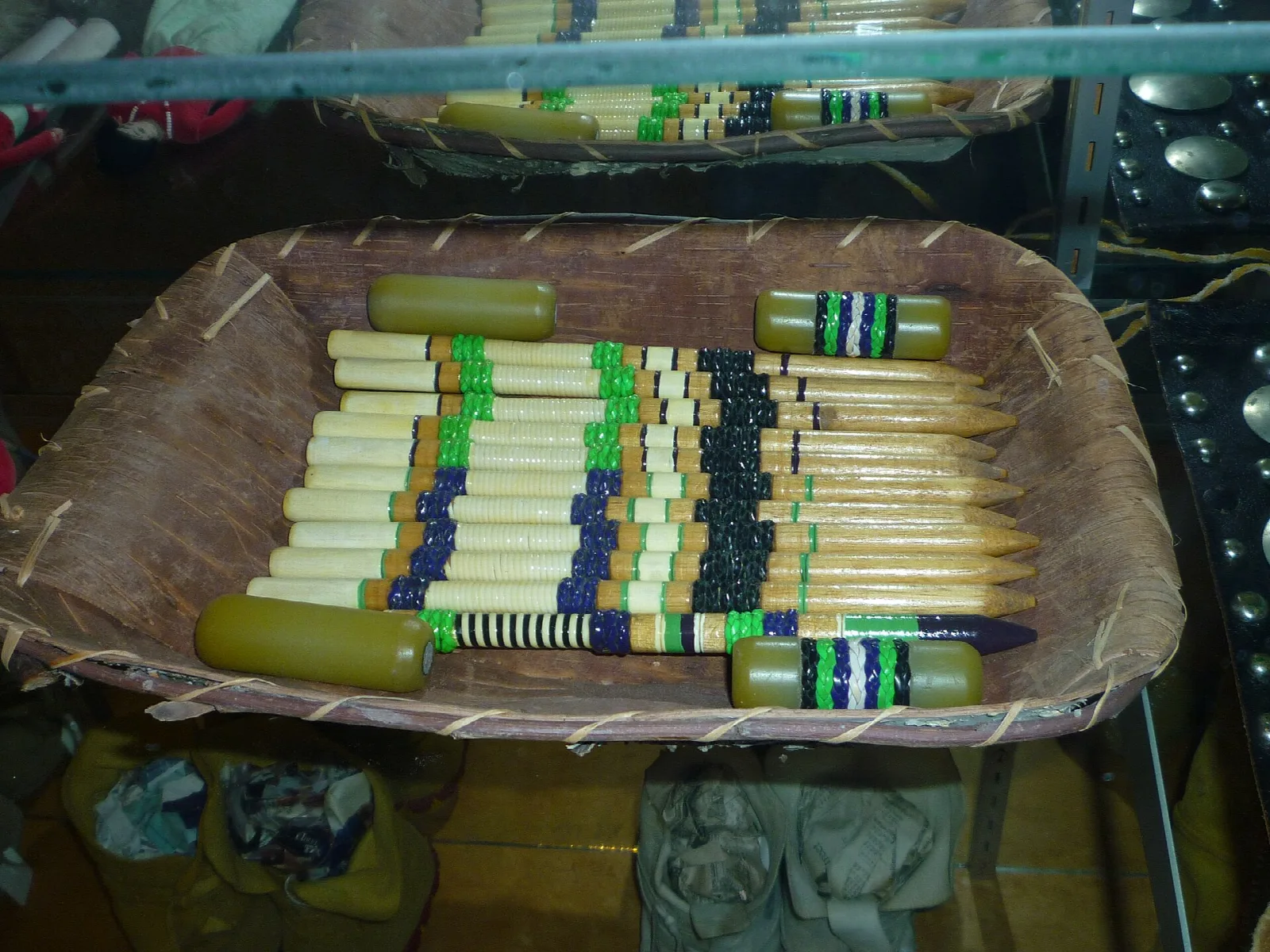 Basket holding beaded stick game pieces
