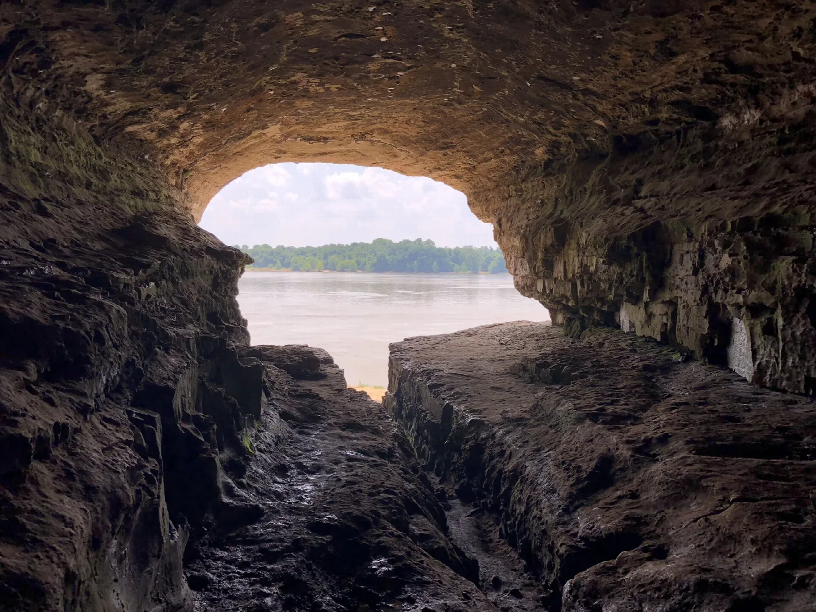 Cave mouth framing the Ohio River and Kentucky shore
