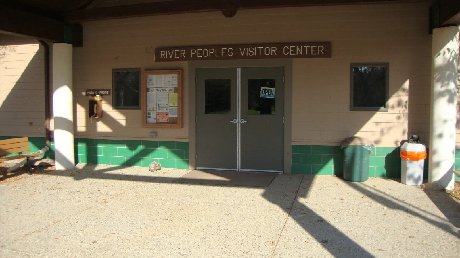 Front entrance of a low building with a River Peoples Visitor Center sign