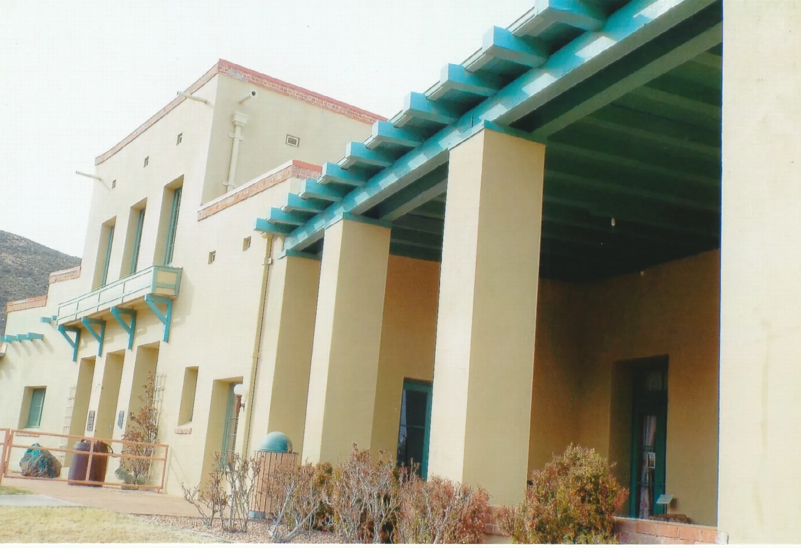 Mansion porch with turquoise beams and square columns