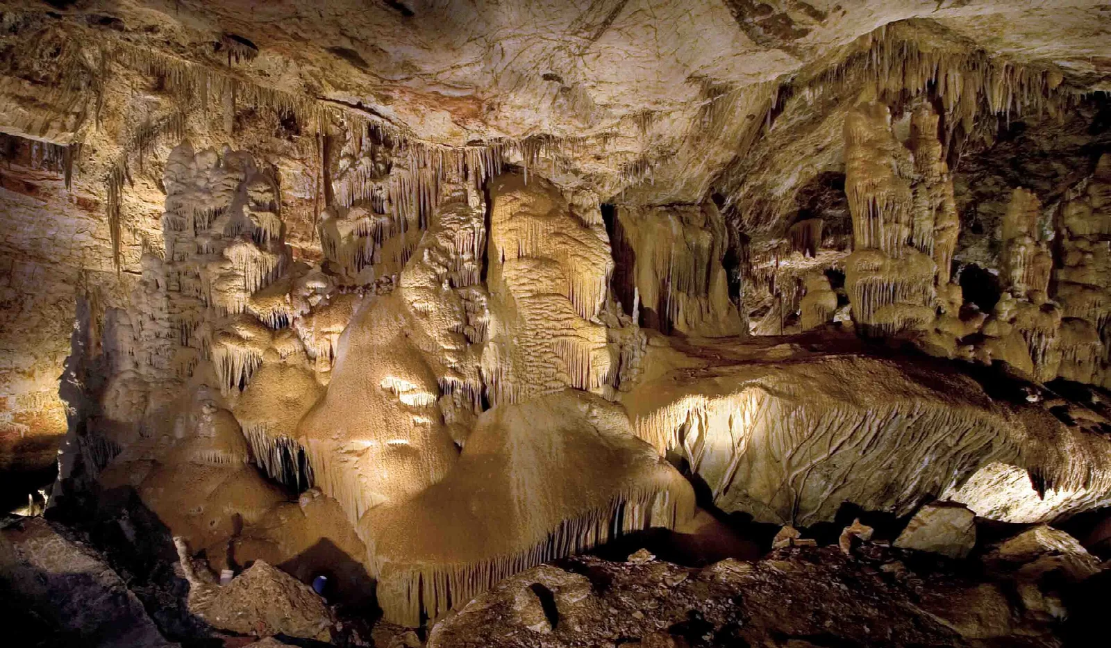 Cave room with tan formations and stalactites
